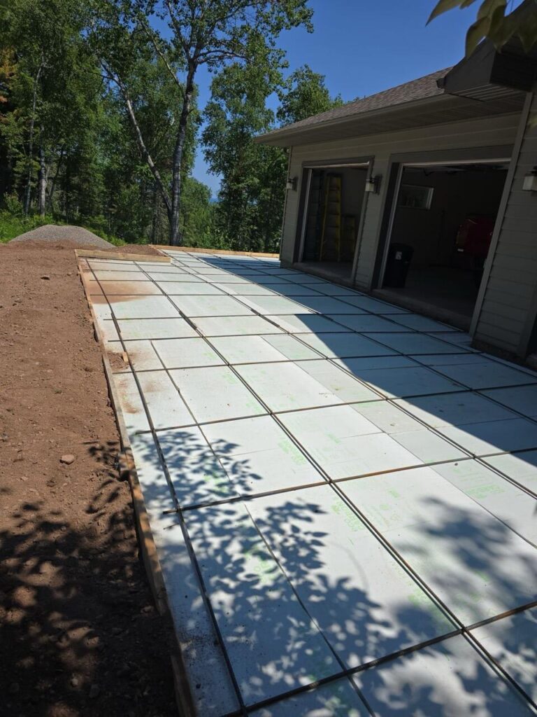 Eco Foam rigid foam board laid below a driveway slab before the pour