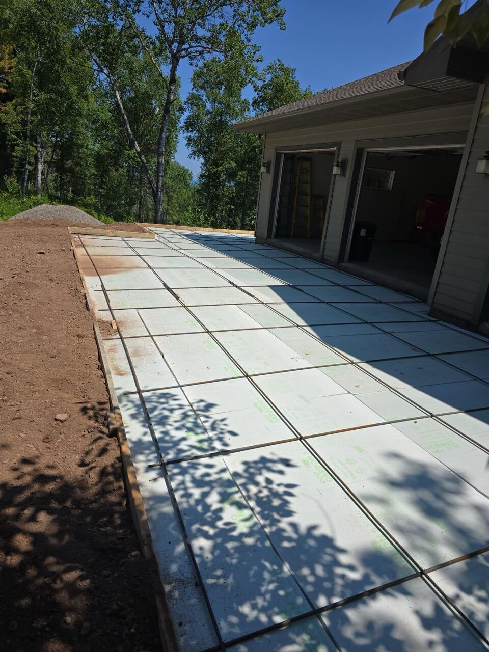 Eco Foam rigid foam board laid below a driveway slab before the pour