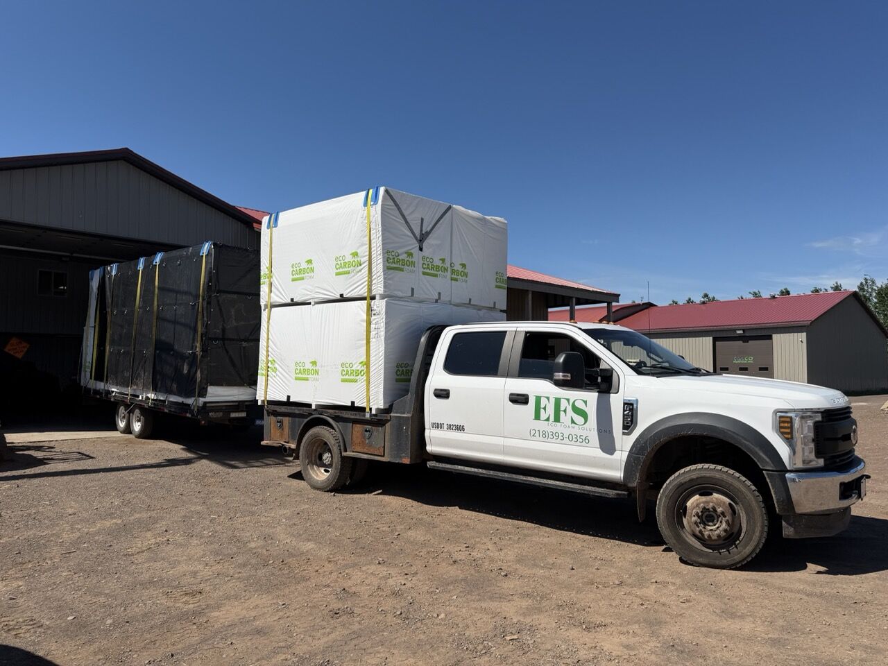 Eco Carbon Foam pallets strapped to an Eco Foam Solutions flatbed truck