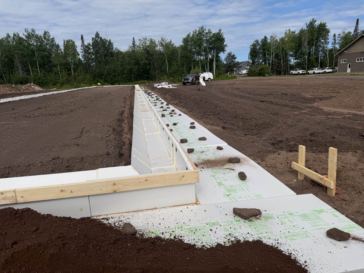 Wide angle view of Eco Foam board against a concrete foundation wall
